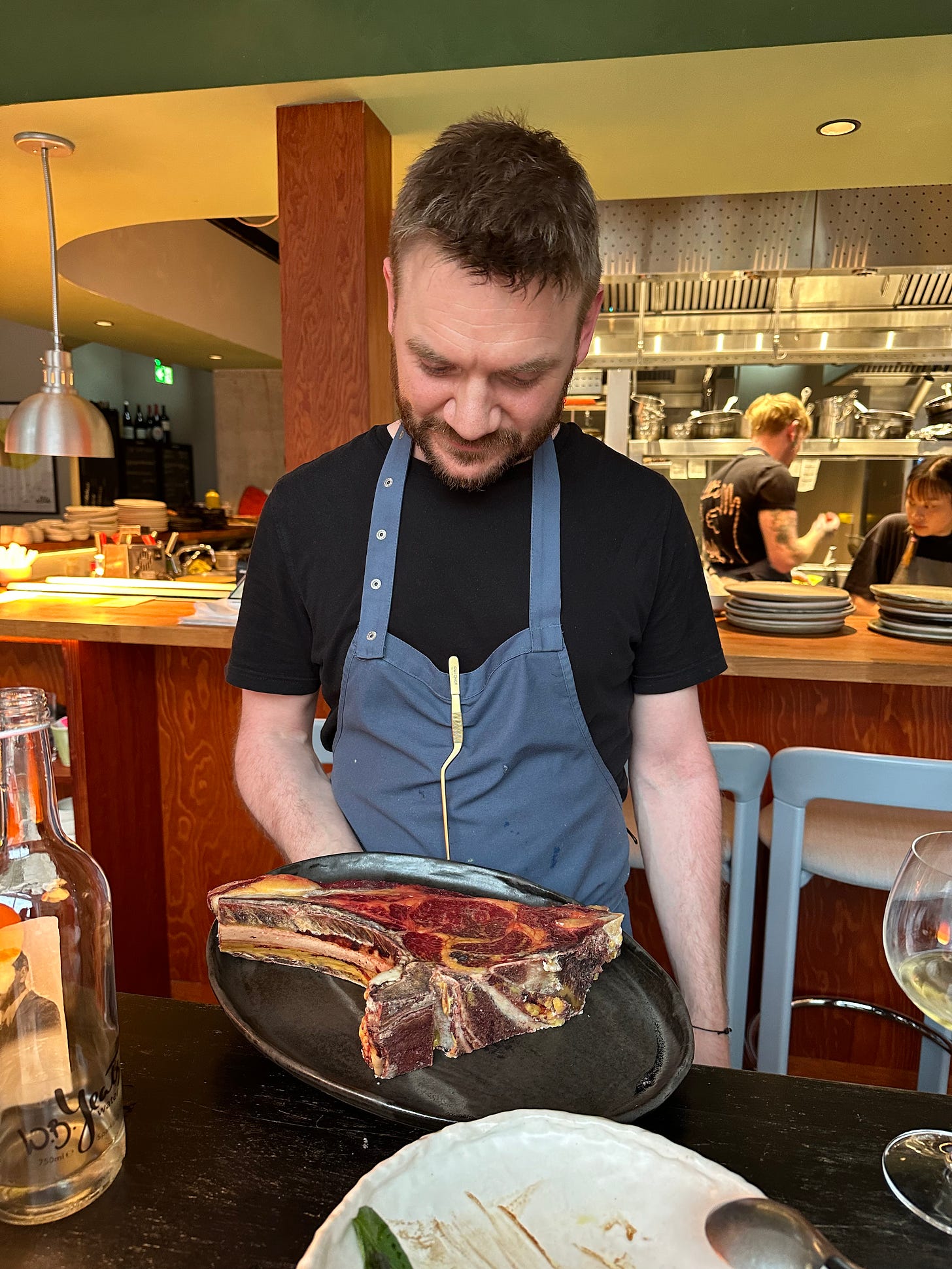 Chef and owner Niall Davidson showing off his aged Jersey beef at Allta