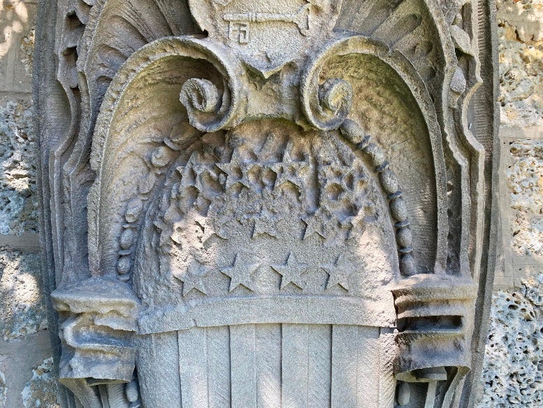 Close-up of the shield on one of the remnant gate posts