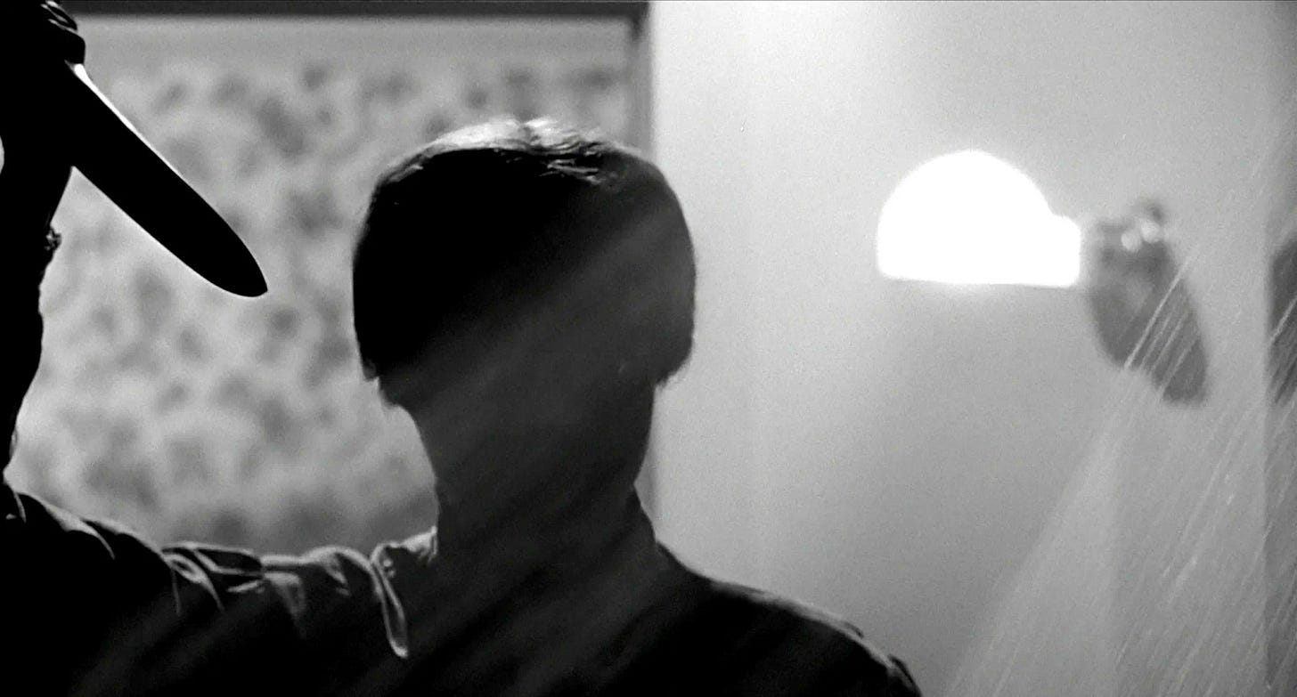 A shot from the 1960 film Psycho. A figure in silhouette approaches a shower with kitchen knife drawn.