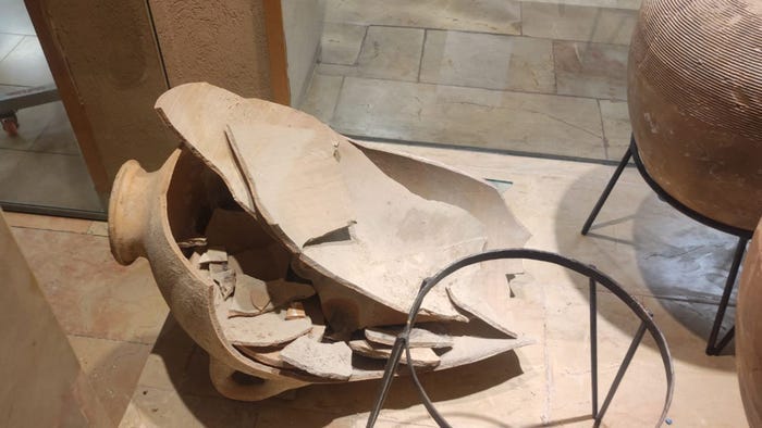 A 3,500-year-old jar lies smashed in pieces at the Hecht Museum in Haifa, Israel.