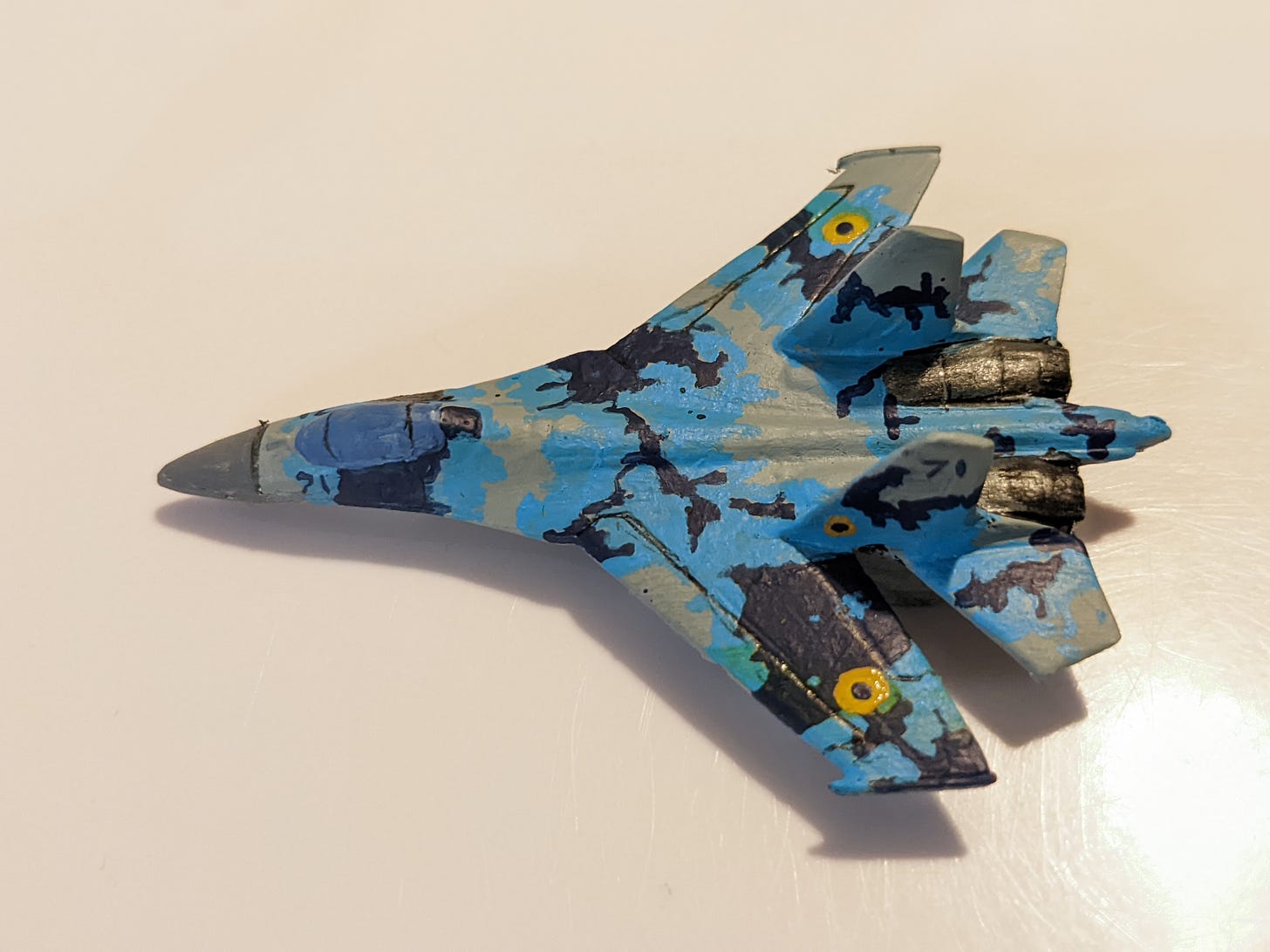 A 6 mm model of an Ukrainian SU-27 fighter jet painted in Ukrainian air force colours.