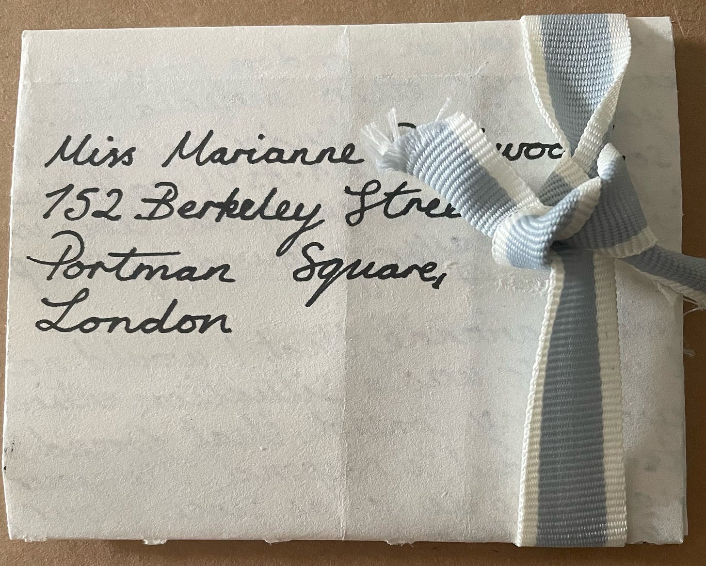 Unopened letter to Marianne tied with a bow. 