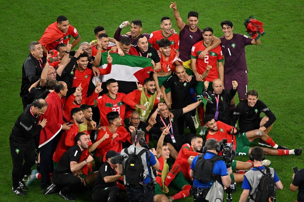 Morocco football team at the 2022 World Cup with the Palestine flag. 