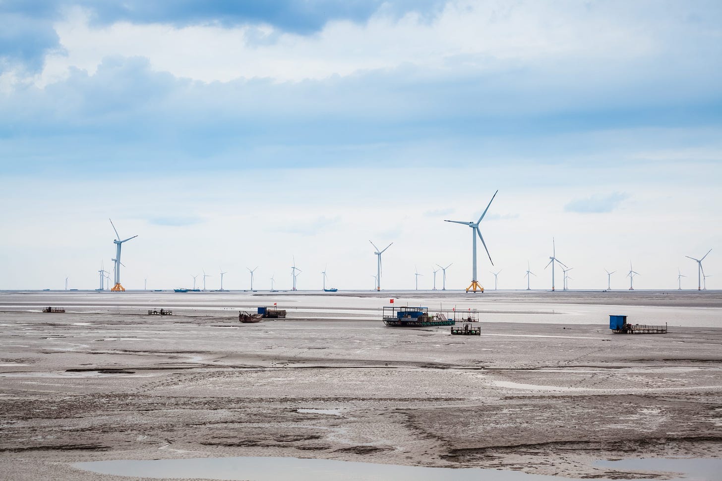 Wind,Farm,At,Mud,Flat,In,Cloudy