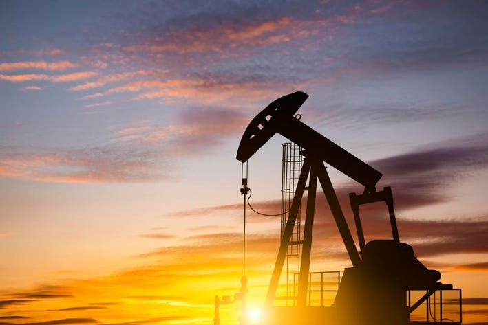 Oil pump on a sunset background. World Oil Industry Oil pump on a sunset background. World Oil Industry