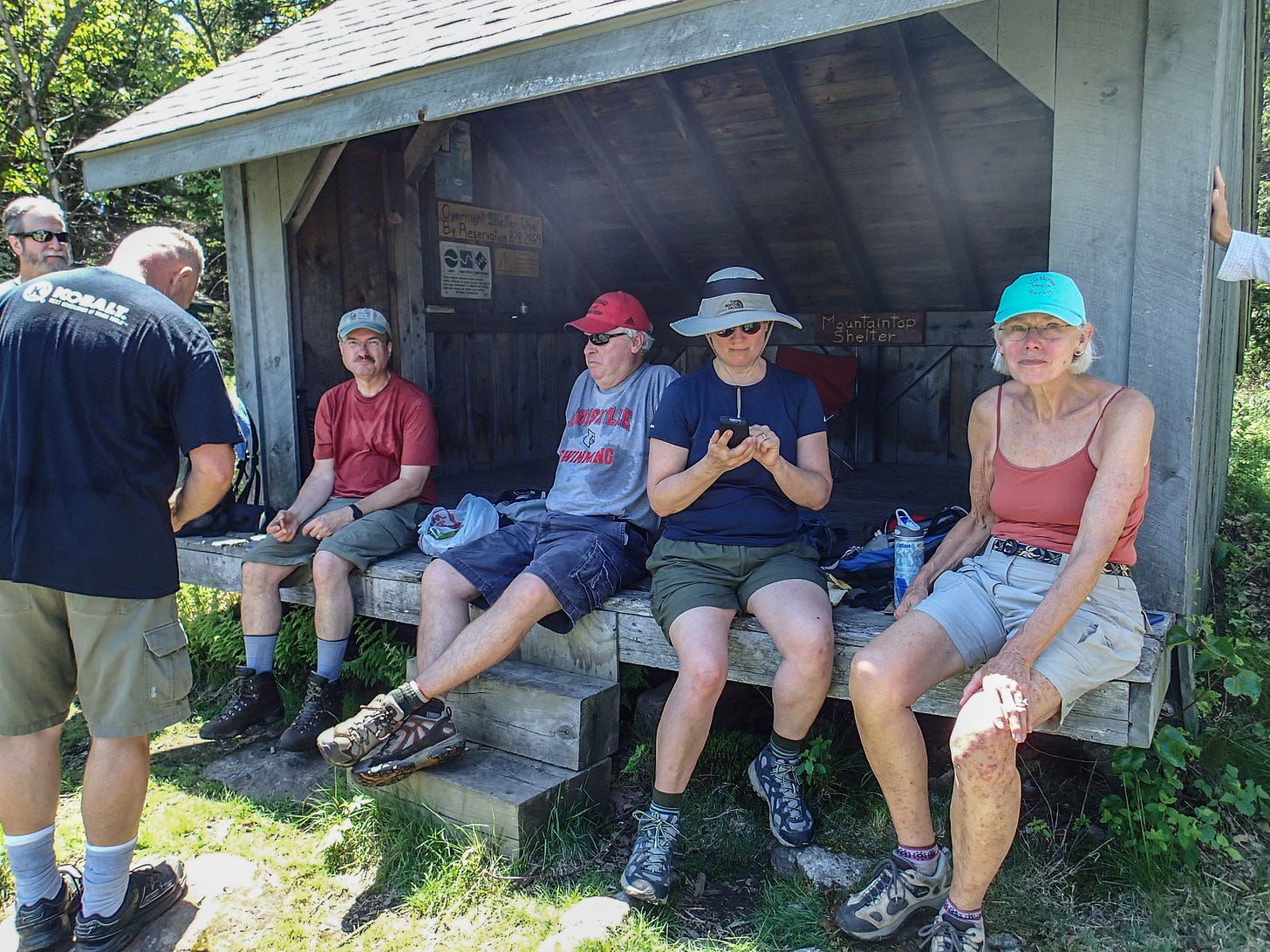 Hikers taking a lunch break at a shelter