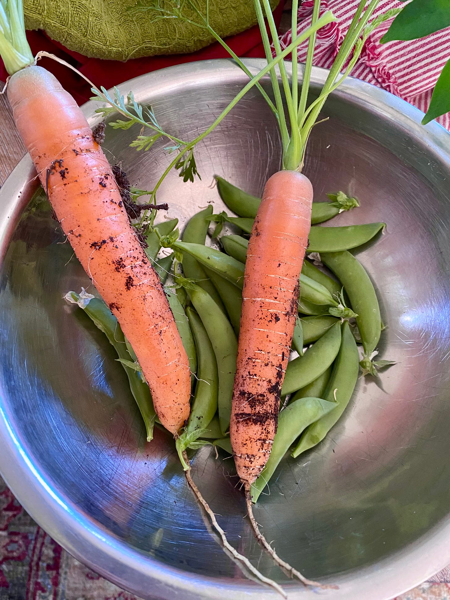 Bowl with carrots and snap peas