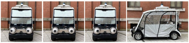 Photo of a golf cart with large googly robot eyes mounted on the front.