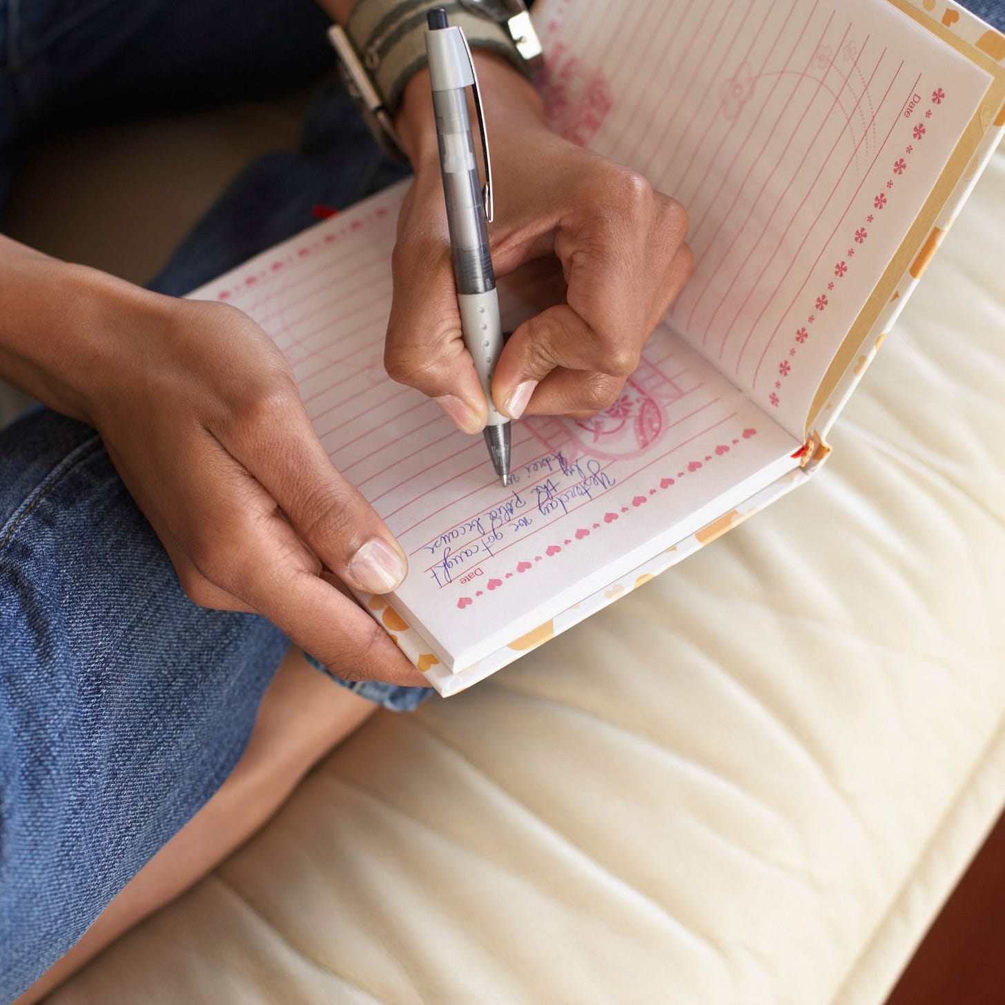 woman handwriting in journal