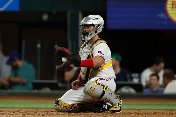 Austin Hedges the Texas Rangers catches in the seventh inning against the Chicago White Sox at Globe Life Field on August 02, 2023 in Arlington,...