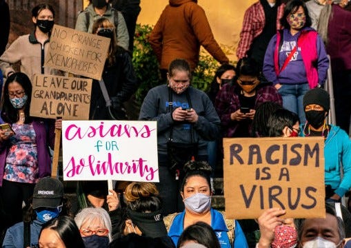 Demonstrators gather for a rally and march against anti-Asian hate and bias in Seattle, Washington