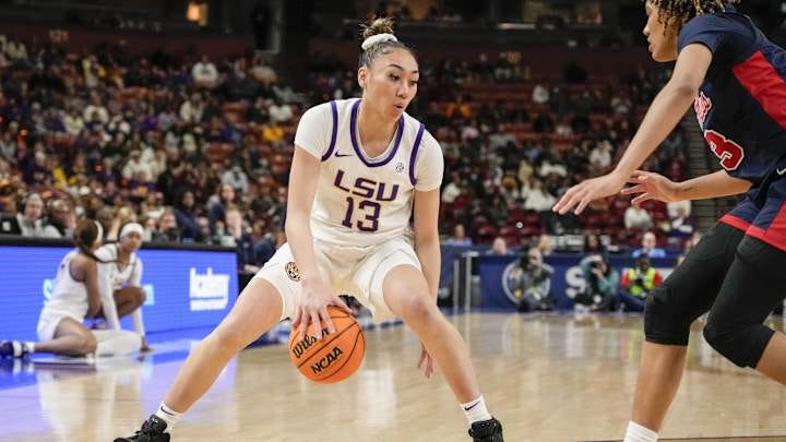 Mar 9, 2024; Greensville, SC, USA; LSU Lady Tigers guard Last-Tear Poa (13) handles the ball against the Ole Miss Rebels during the second half at Bon Secours Wellness Arena. Mandatory Credit: Jim Dedmon-Imagn Images