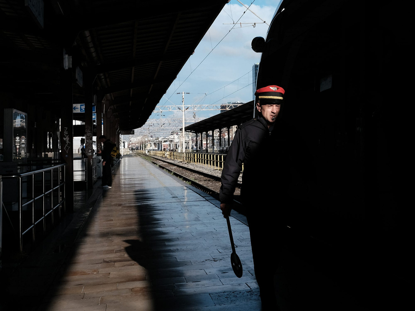 An officer inspects the train before departure at the main railroad station in Zagreb, Croatia.