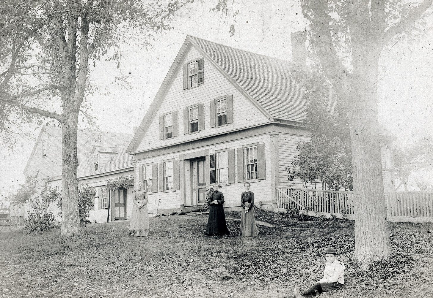 three people in front of Carlson residence