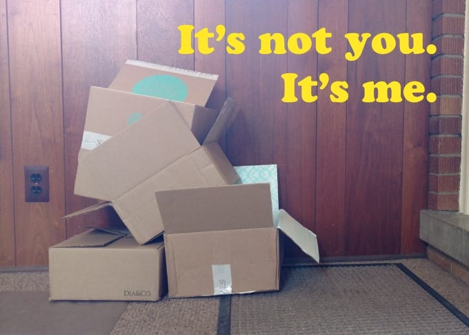 A pile of cardboard shipping boxes with the text 'it's not you it's me'.