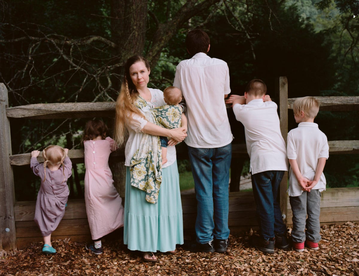 "A Wife With a Purpose," the online super star Ayla Stewart, poses for a portrait at a public park in Tennessee on August 23, 2017 along with her six children. She's known for promoting #tradlife (traditionalist homemaking and white culture). She's been kicked off twitter for hate speech, though has started accounts on Gab and other platforms, and continues to have a huge youtube following. Though she believes there are many definitions of the word Nazi, she says there is only one definition of the word racist and she claims she is not racist.