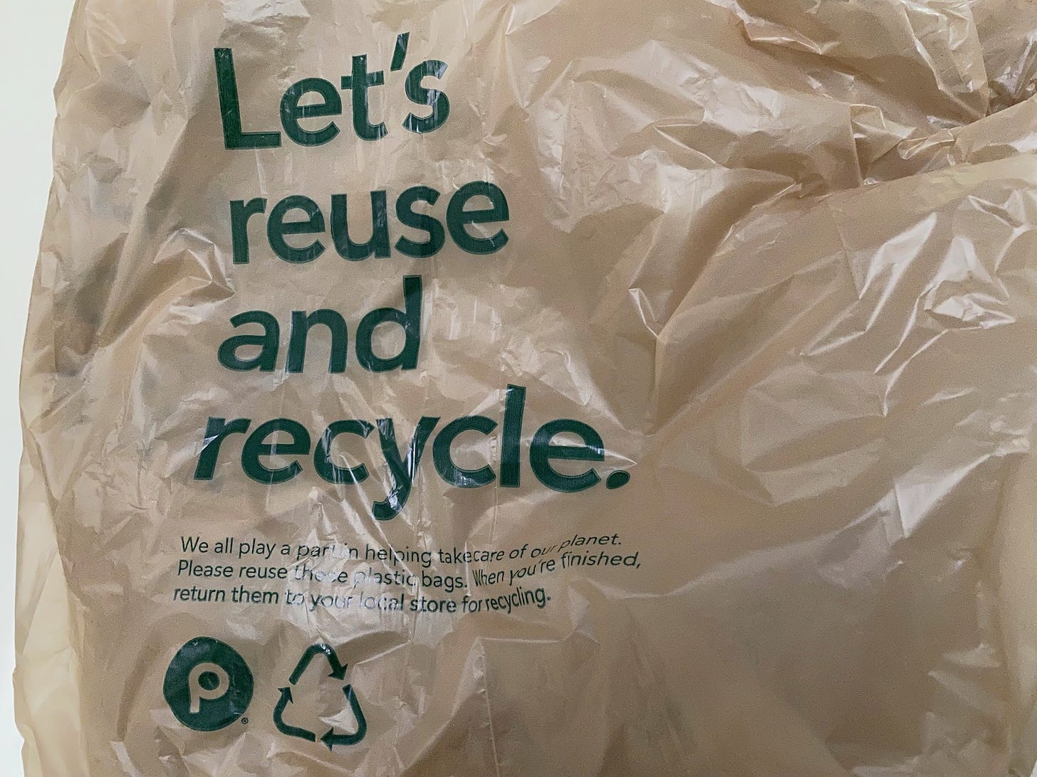 Plastic bag with text: Let's reuse and recycle