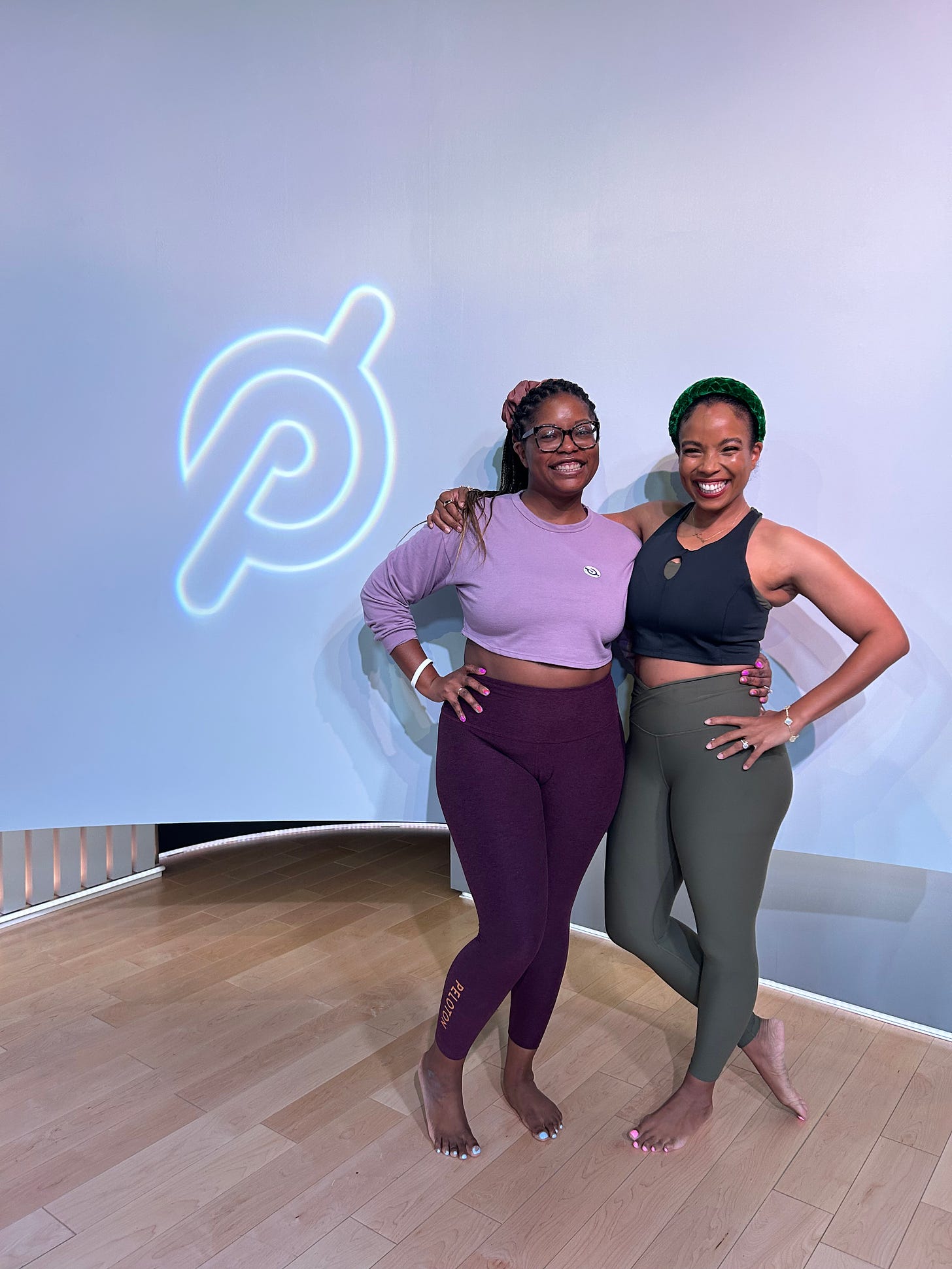 Picture of two Black women standing next to each other in Peloton's yoga studio