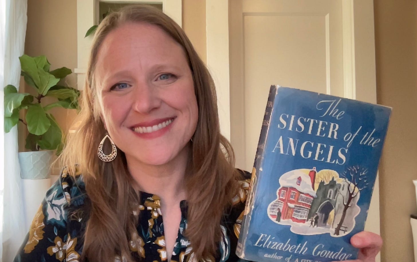 Julie Witmer with her copy of Sister of the Angels