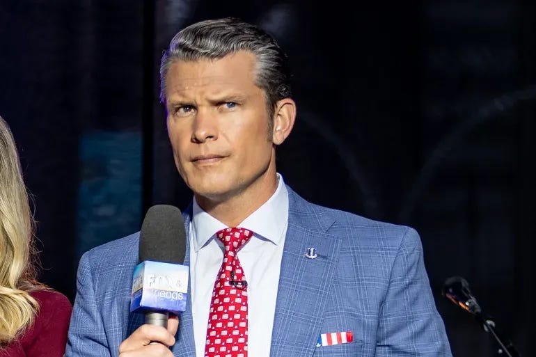 Pete Hegseth, holding a microphone, looking perturbed.