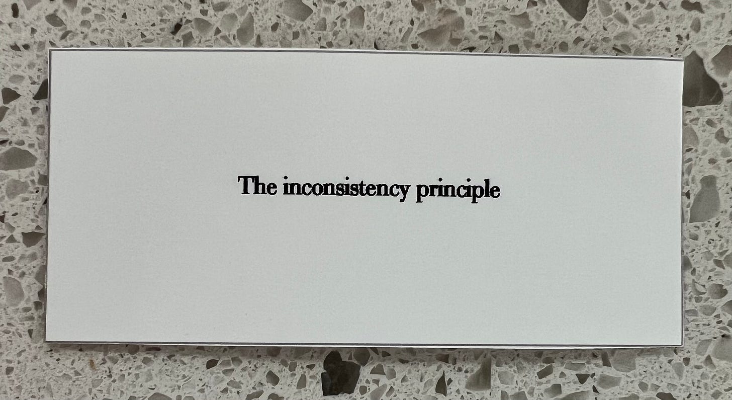 a simple white card that reads: "The inconsistency principle"