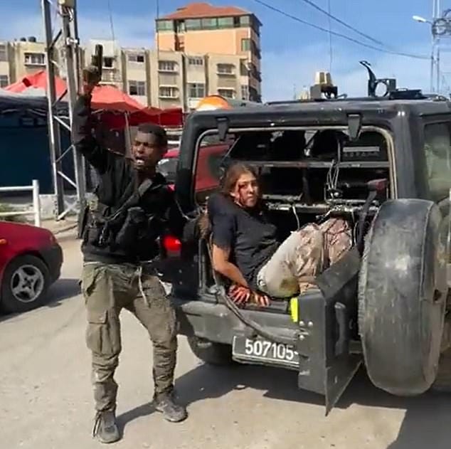 How is it that Hamas has defenders? How does barbarism have any place in our modern age? A post-Holocaust world that vowed ‘never again’ has, this weekend, witnessed Jews ripped from the safety of their homes and places of business. (Pictured: A hostage is held by Hamas).