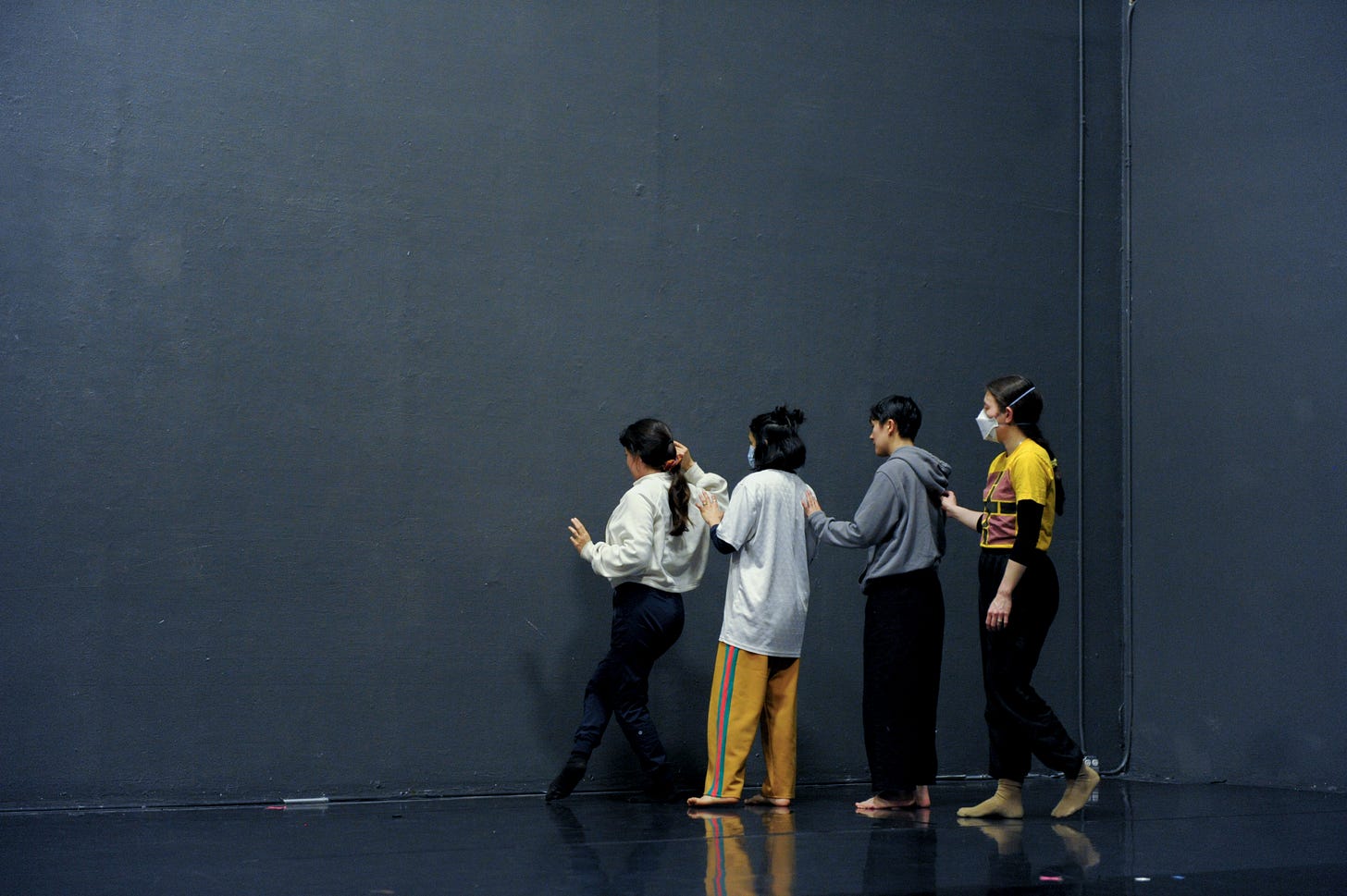 four dancers in rehearsal