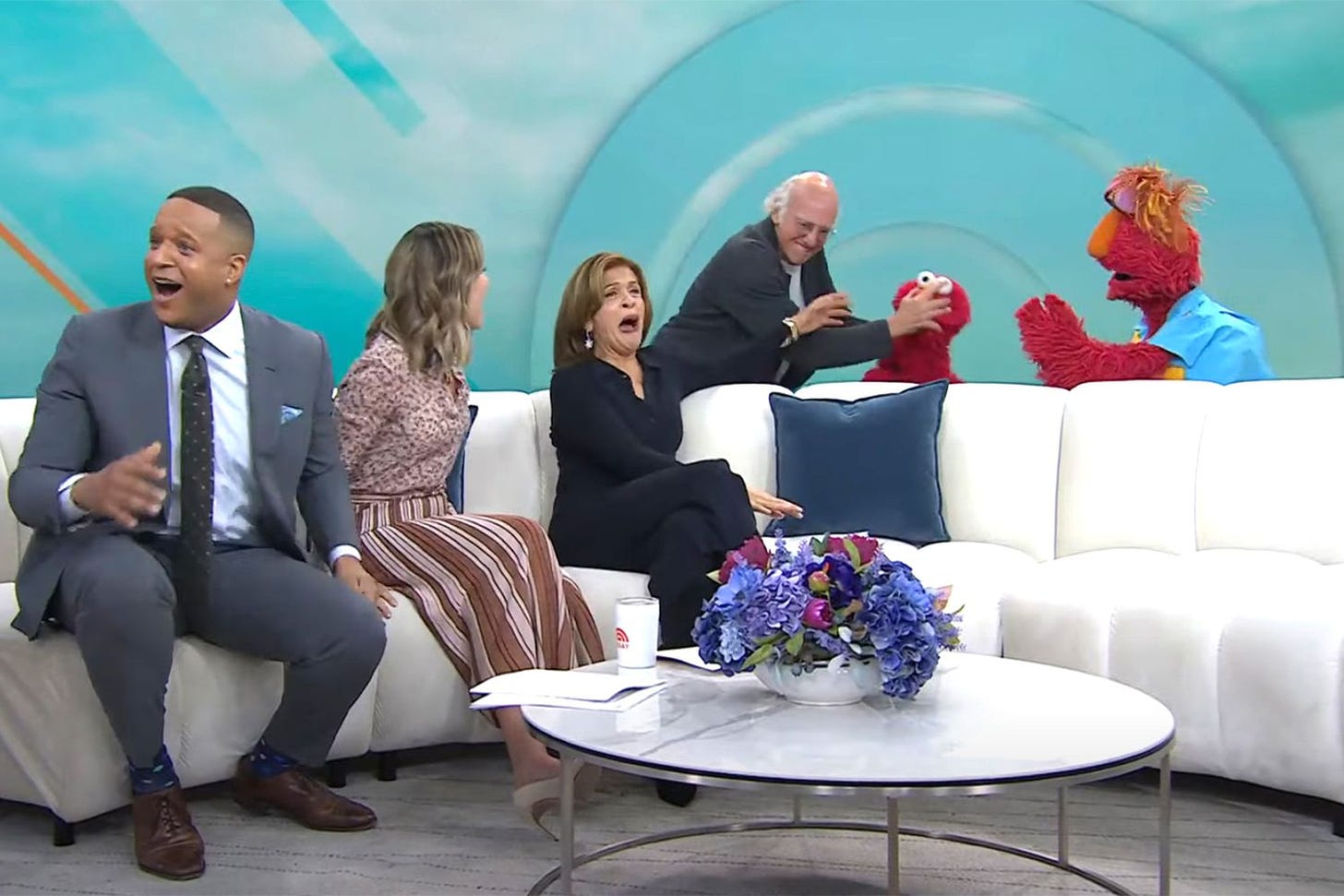 Larry David on the Today Show strangling Elmo. The hosts all look shocked and scandalized.