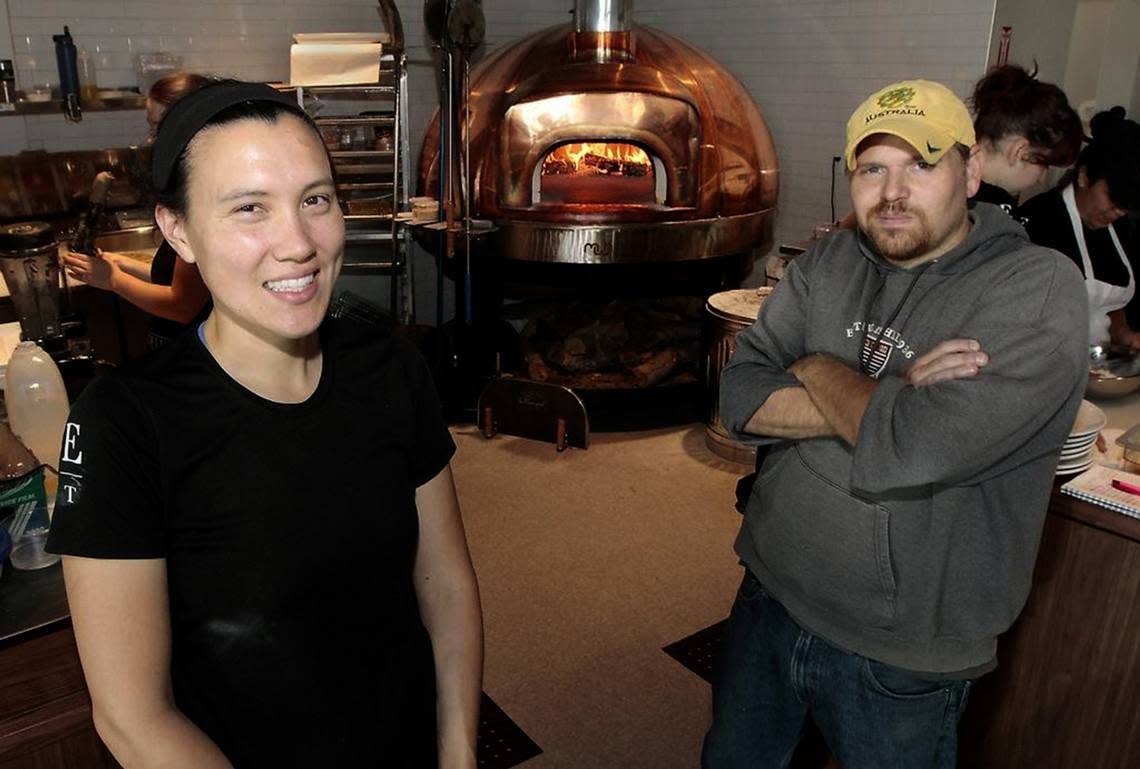 Angela Kora, left, and Scot Newell, co-owners of Ethos Bakery & Trattoria, at the 2015 grand opening of the restaurant in north Richland.