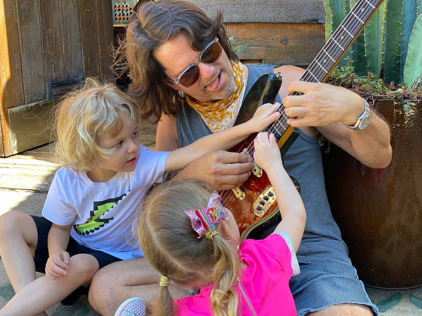 Owen Muir MD's children learn bass guitar