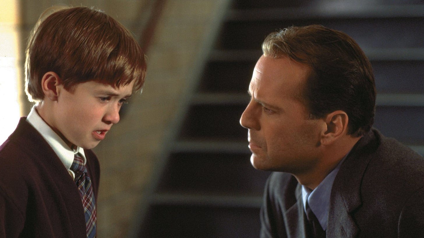 The Sixth Sense | Still features Haley Joel Osment (left) as Cole Sear, a young boy who is visited by ghosts. He talks about this with Dr. Malcolm Crowe (Bruce Willis).