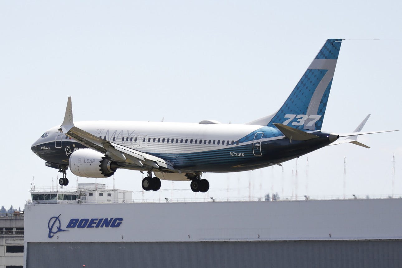 A Boeing 737 MAX jet lands following a Federal Aviation Administration test flight.