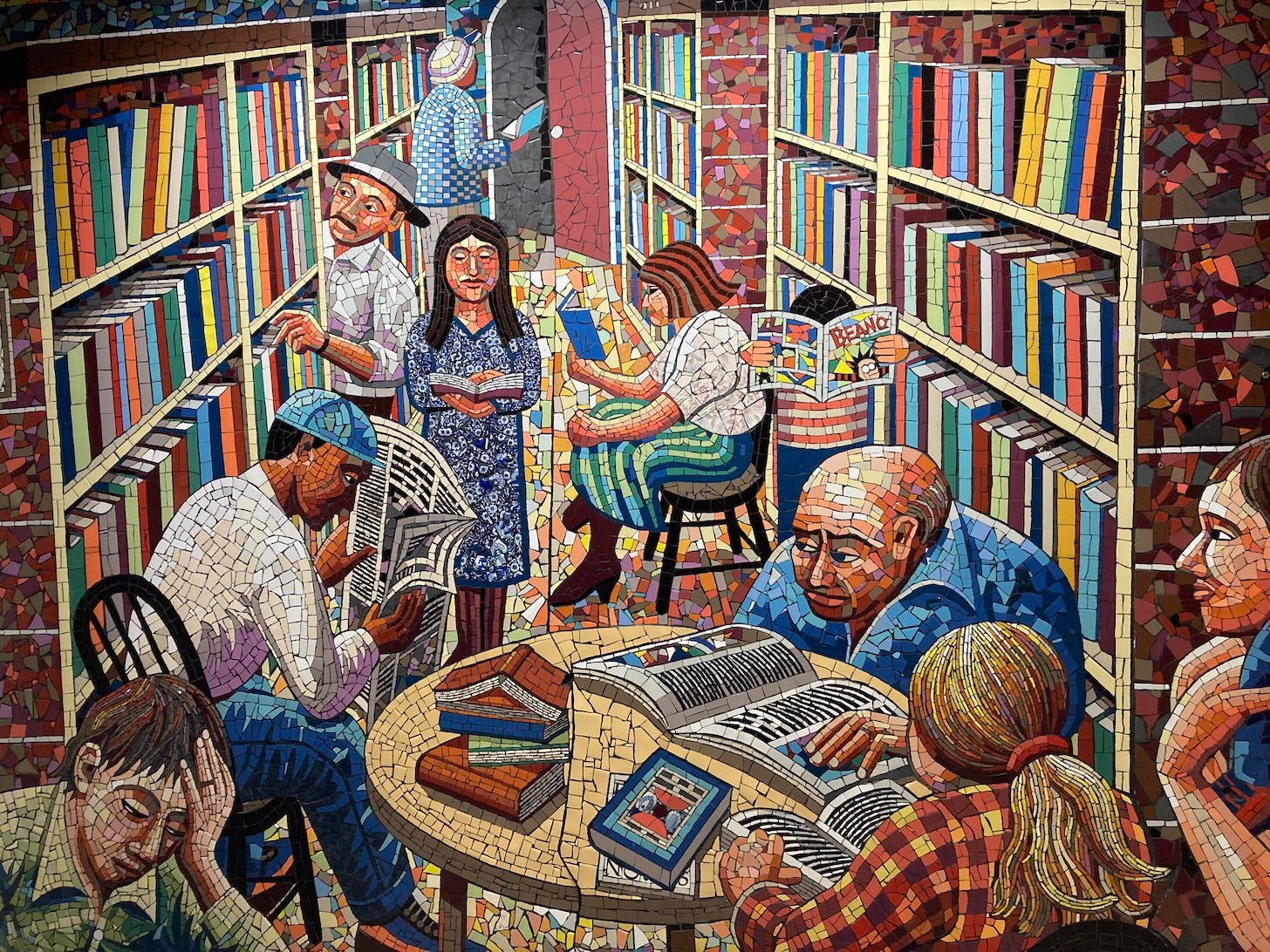 Mosaic of people reading books in a library made by Jim Anderson and photo taken by Yasmin Chopin at Addenbrookes Hospital Cambridge, UK