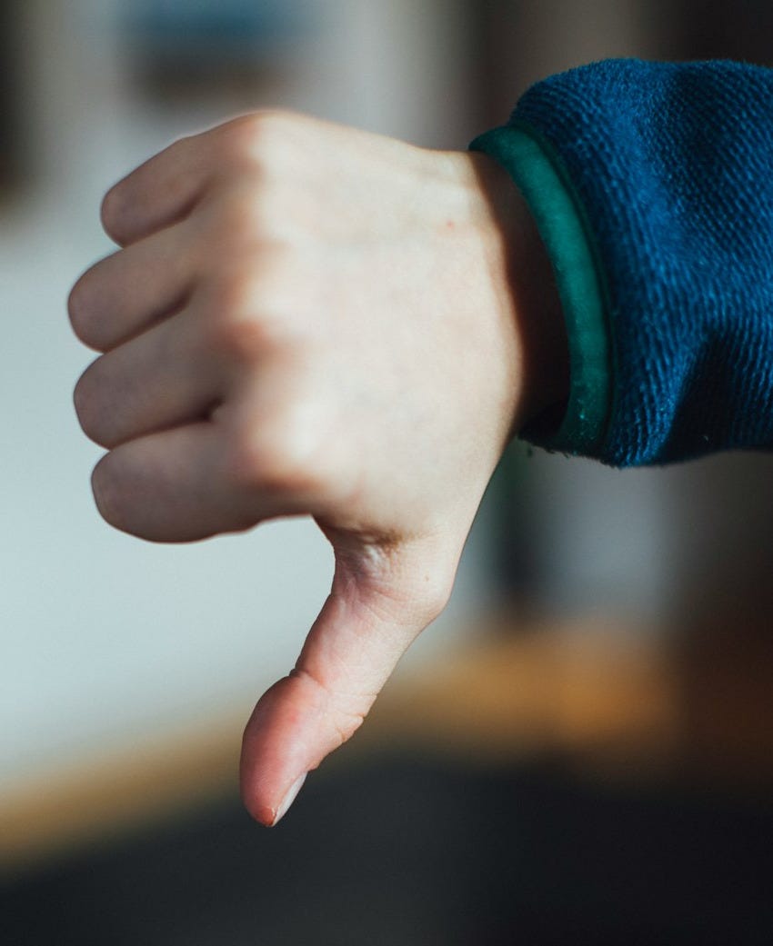 person in blue long sleeve shirt showing right hand person in blue long sleeve shirt showing right hand