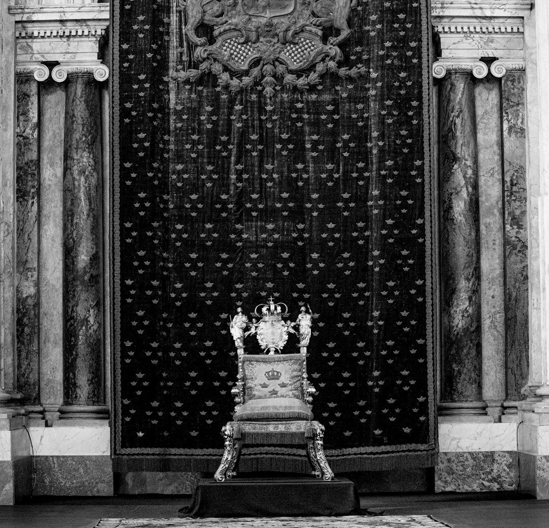 a statue in front of a green door