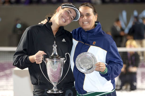 Garbiñe Muguruza of Spain poses with her coach Conchita Martinez after defeating Anett Kontaveit of Estonia during the Women's Singles Final on Day 8...
