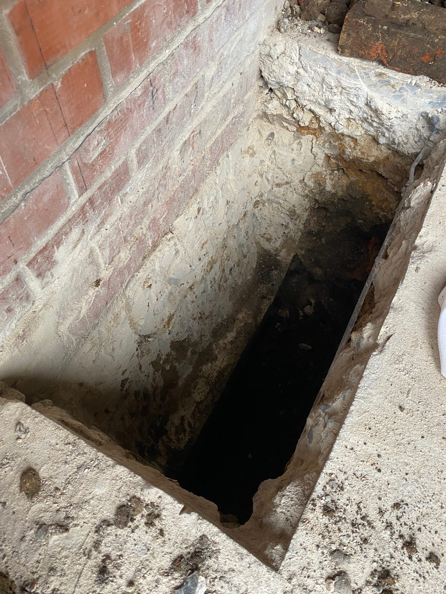 very deep hole in the garage floor