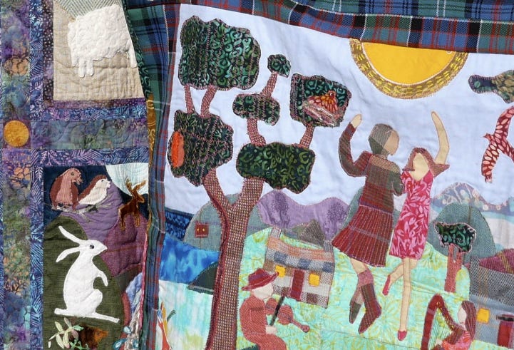 quilt featuring fabric illustrations of Highland stories. The quilt features animals, plants, and also people highland dancing and playing the fiddle