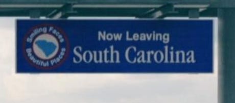 "now leaving south carolina" sign