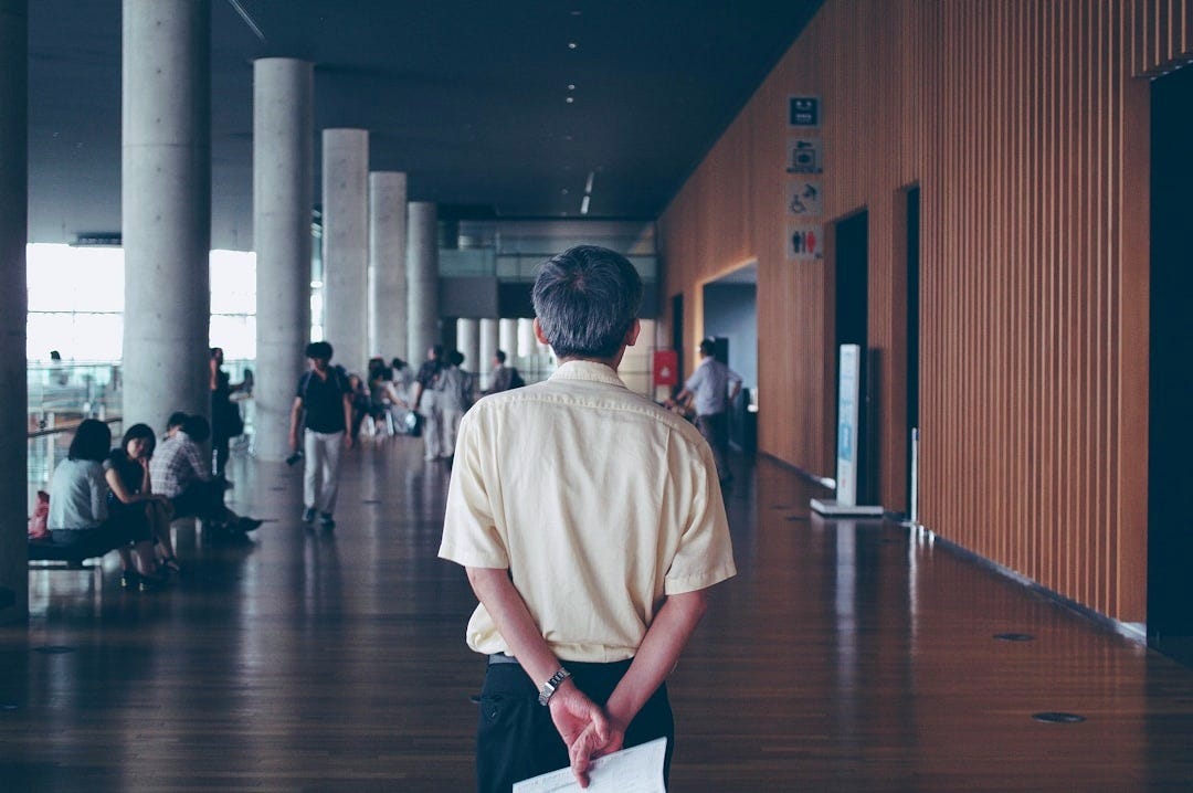 man walking near people man walking near people