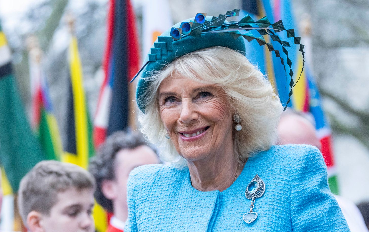 Queen Camilla in turquoise coat and hat
