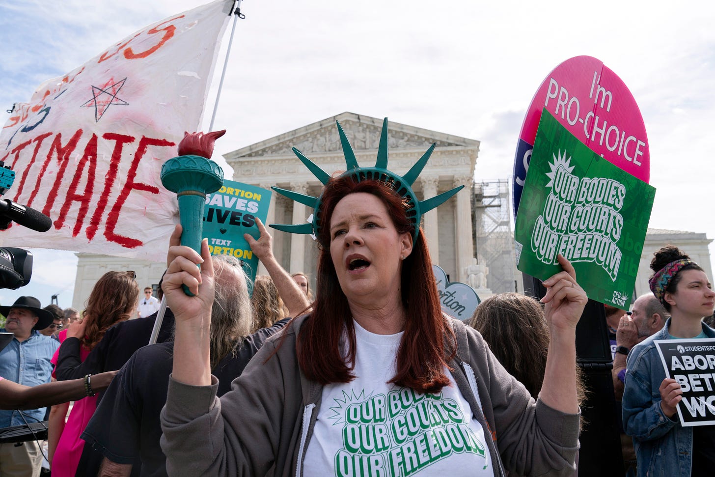 Abortion rights activists rally outside the Supreme Court.