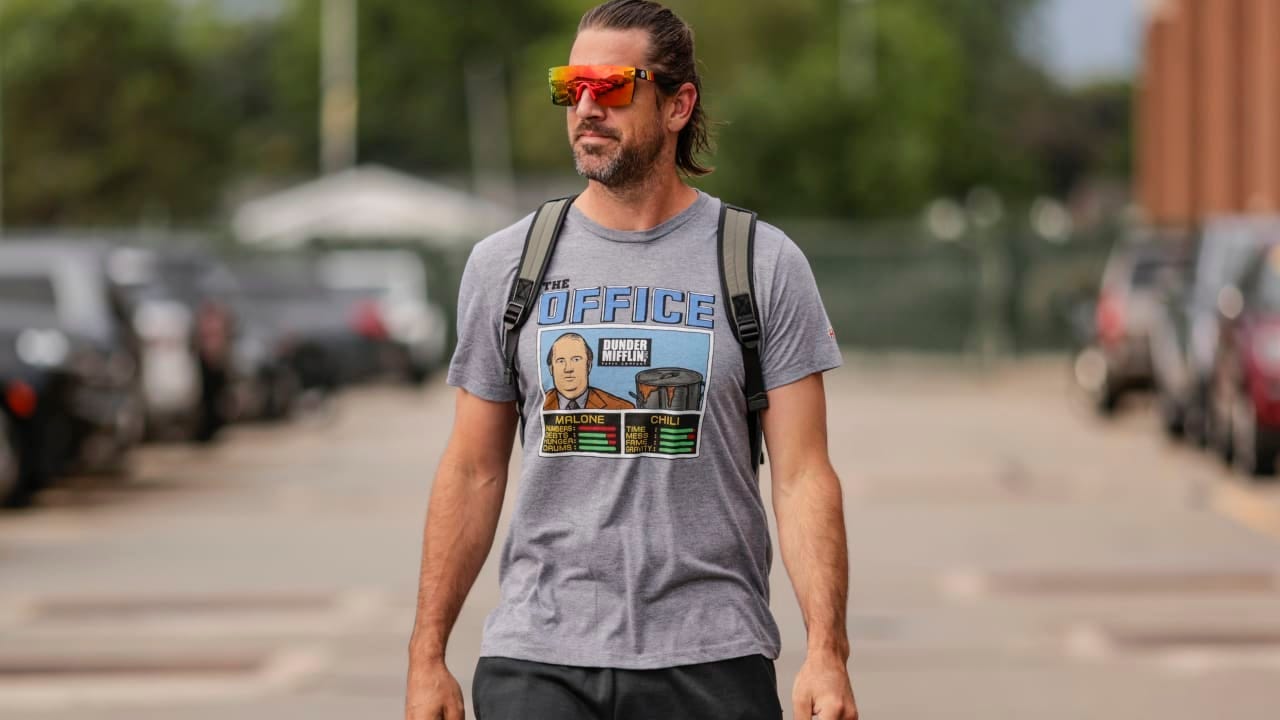 NFL QB Aaron Rodgers wearing shades and a t-shirt from “The Office” NFL QB Aaron Rodgers wearing shades and a t-shirt from “The Office”