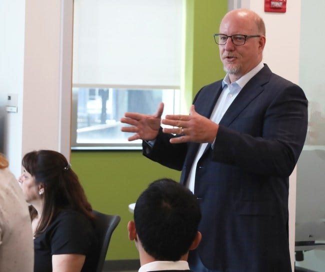 Rob Davis speaking to a group of people