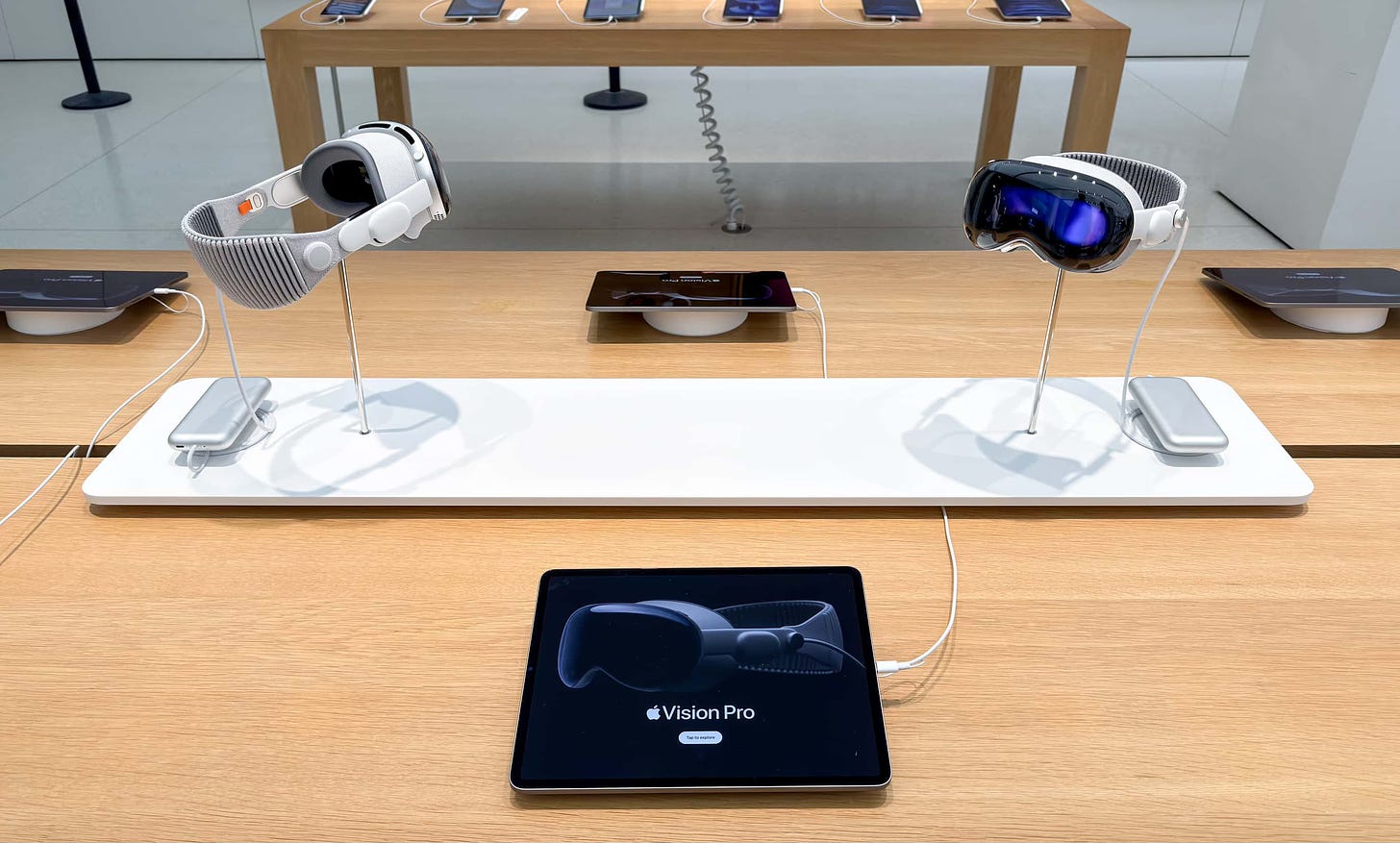 An Apple Vision Pro riser on a store table.