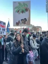 Metropolitan Police Marieha Hussain carrying a placard