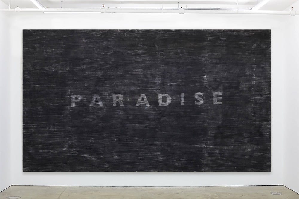 Photograph of an art installation with the word PARADISE in all caps san serif letters on a sooty background.