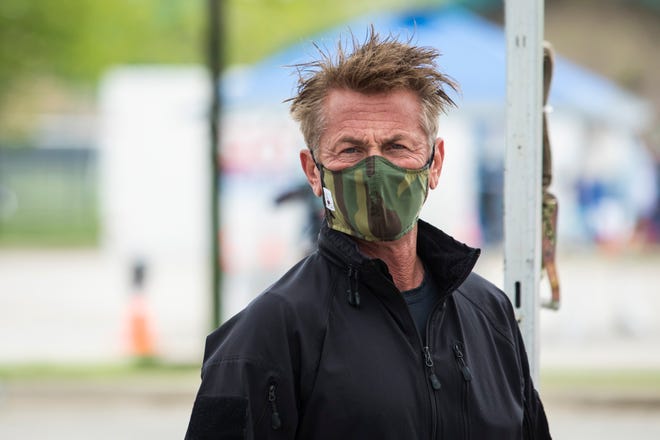 Actor and activist Sean Penn speaks during a press conference to announce a new coronavirus drive-thru testing site in Chicago, organized by the CORE disaster relief organization started by Penn on May 18, 2020.