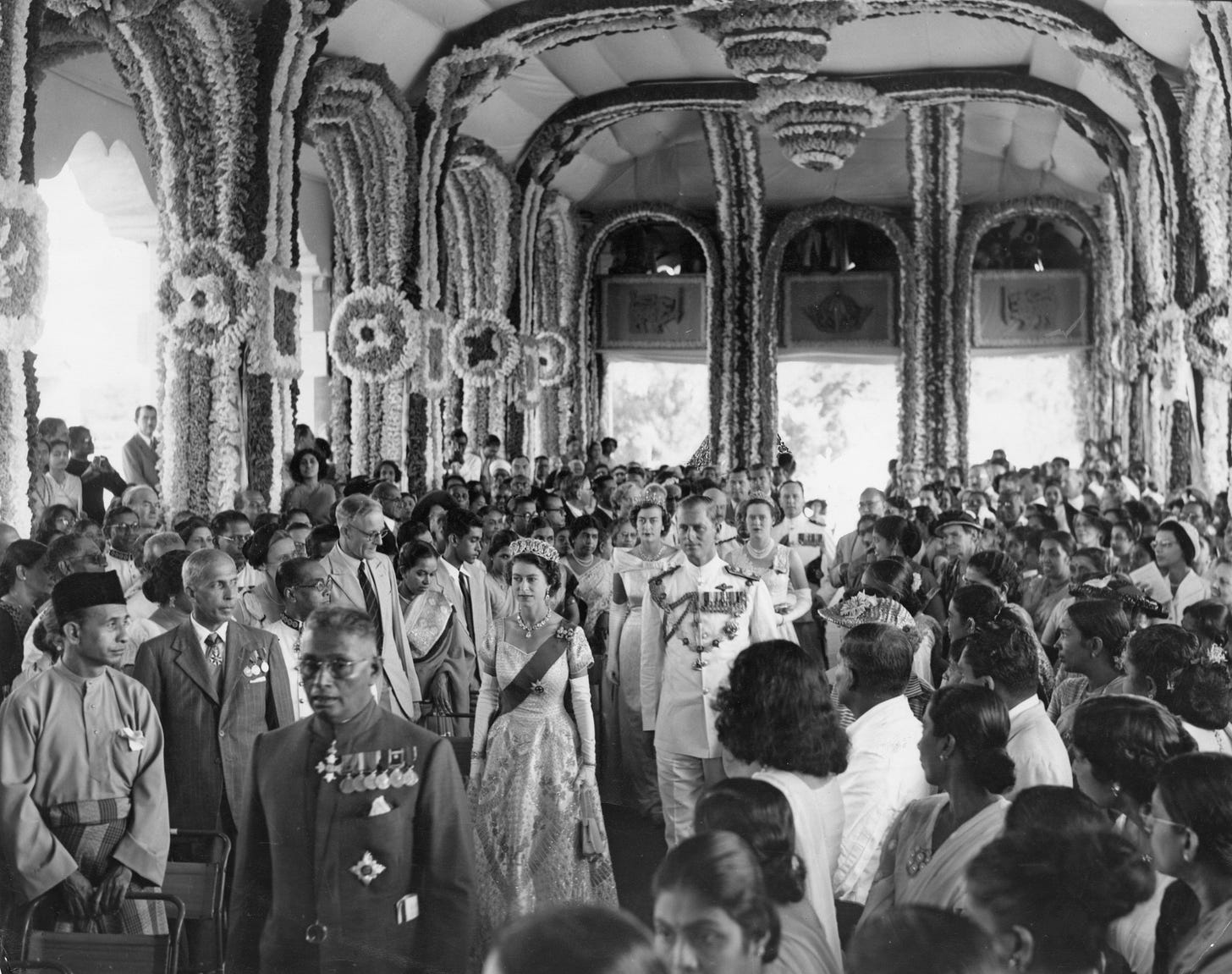 Queen Elizabeth II and Prince Philip in finery