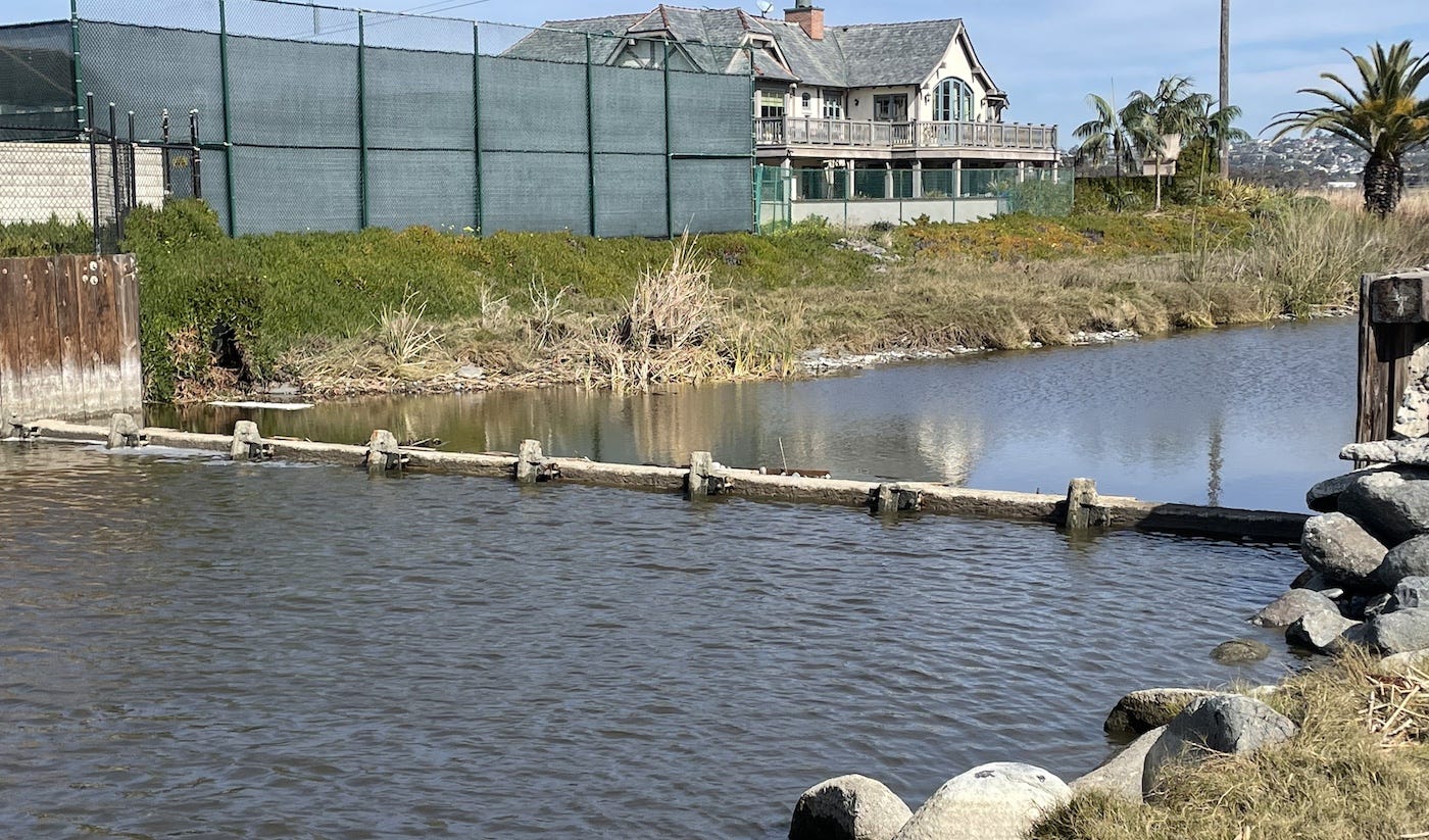 The Buena Vista Creek weir, or dam, suffered three breeches from recent storms while the City of Oceanside has completed a temporary fix. The city is in the process of getting permission for a more permanent fix. Steve Puterski photo